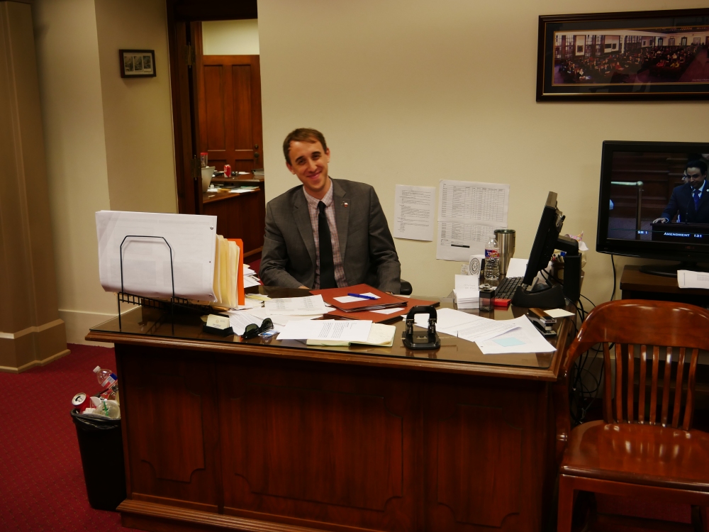 David Feigen, legislative director, sitting at his desk - Photo by John Hernandez